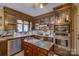 Well-equipped kitchen boasting stained wood cabinets, stainless steel appliances, and a functional kitchen island at 40 Old Rd, Taylorsville, NC 28681
