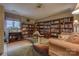 Inviting library with custom built-in bookshelves and a cozy seating area, creating a perfect reading retreat at 40 Old Rd, Taylorsville, NC 28681