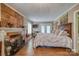 Serene main bedroom features a fireplace, wood flooring, and a comfortable bed for restful nights at 40 Old Rd, Taylorsville, NC 28681