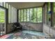 Relaxing screened porch with nature views, creating a perfect outdoor retreat at 40 Old Rd, Taylorsville, NC 28681