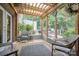 Enclosed sunroom with tiled flooring and wood framing, providing a comfortable outdoor living space at 40 Old Rd, Taylorsville, NC 28681