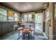 Charming sunroom with ample natural light, a cozy table, and an inviting atmosphere for relaxation at 40 Old Rd, Taylorsville, NC 28681