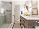 Bathroom boasts a double vanity and a walk-in shower with modern fixtures at 401 N Church St # 201, Charlotte, NC 28202