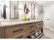 Modern bathroom featuring double sinks, quartz countertops, and decorative lighting at 401 N Church St # 201, Charlotte, NC 28202