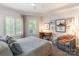 Bedroom with a desk, comfortable chair, and bright windows for natural light at 401 N Church St # 201, Charlotte, NC 28202