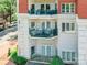 Exterior shot of building showing multiple balconies, architectural details and greenery at 401 N Church St # 201, Charlotte, NC 28202