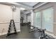 Gym featuring various workout equipment, weights, and rubber flooring at 401 N Church St # 201, Charlotte, NC 28202