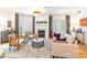 Inviting living room featuring hardwood floors, a fireplace, neutral decor, and lots of natural light at 401 N Church St # 201, Charlotte, NC 28202
