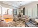 Comfortable living room with an L-shaped sofa, and bright windows at 401 N Church St # 201, Charlotte, NC 28202