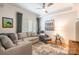 Cozy living room with a plush sofa, armchair, and bright window at 401 N Church St # 201, Charlotte, NC 28202