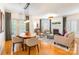 Bright living room featuring hardwood floors, a fireplace, neutral decor, and lots of natural light at 401 N Church St # 201, Charlotte, NC 28202