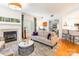 Cozy living room with hardwood floors, a fireplace, neutral decor, and bright, natural light at 401 N Church St # 201, Charlotte, NC 28202