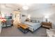 Large main bedroom with a seating area, desk, and carpet at 401 N Church St # 201, Charlotte, NC 28202