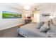 Large main bedroom with a seating area, desk, and wall art at 401 N Church St # 201, Charlotte, NC 28202