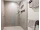 Modern shower with gray tile surround, sleek fixtures, and towel bars at 401 N Church St # 201, Charlotte, NC 28202