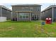 Spacious backyard with green grass, mature trees, and a seating area, perfect for outdoor activities and relaxation at 4305 Twenty Grand Dr, Indian Trail, NC 28079