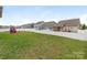 Expansive backyard with a privacy fence and lush lawn, ideal for outdoor activities and enjoying the surrounding views at 4305 Twenty Grand Dr, Indian Trail, NC 28079