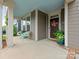 Inviting front porch with seating and stylish decor leading to the home's entrance at 4305 Twenty Grand Dr, Indian Trail, NC 28079