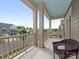 Inviting front porch with white railings and blue ceiling, offering a relaxing outdoor space with wicker furniture at 4305 Twenty Grand Dr, Indian Trail, NC 28079