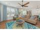 Bright and airy living room with large windows, hardwood floors, and comfortable seating arrangements at 4305 Twenty Grand Dr, Indian Trail, NC 28079