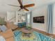 Cozy living room with hardwood floors, ceiling fan, and accent rug at 4305 Twenty Grand Dr, Indian Trail, NC 28079