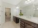 Main bathroom featuring double sinks, quartz counters, and walk in closet at 4305 Twenty Grand Dr, Indian Trail, NC 28079