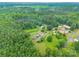Expansive aerial view of a property surrounded by lush greenery and mature trees at 4373 Wentz Rd, Maiden, NC 28650