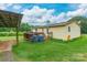 Backyard featuring a wooden deck, shed, green grass and a house in background at 4373 Wentz Rd, Maiden, NC 28650