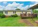 Backyard featuring a wooden deck, green grass and a house in background at 4373 Wentz Rd, Maiden, NC 28650