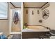 A bathtub and separate shower stall, with the walls painted in neutral colors, creating a comfortable space at 4373 Wentz Rd, Maiden, NC 28650