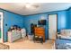 Bedroom featuring blue walls, carpet, and a window for natural light at 4373 Wentz Rd, Maiden, NC 28650