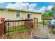 A wooden deck with a table, chairs, railing, and backyard view at 4373 Wentz Rd, Maiden, NC 28650