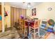 A dining area featuring a table with chairs and an eclectic mix of décor and colors, under a hanging light fixture at 4373 Wentz Rd, Maiden, NC 28650