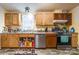 Functional kitchen featuring wooden cabinets, stainless steel appliances, and a practical layout at 4373 Wentz Rd, Maiden, NC 28650
