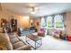 Inviting living room with plush seating, large windows, and a neutral color scheme at 4373 Wentz Rd, Maiden, NC 28650