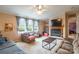 Bright living room with large windows, a fireplace, and comfortable seating area at 4373 Wentz Rd, Maiden, NC 28650