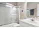 Cozy bathroom with tiled shower and modern vanity with clean, white cabinets at 4764 Brockton Nw Ct, Concord, NC 28027
