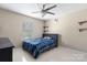 Comfortable bedroom with ample natural light, featuring a ceiling fan and neutral decor at 4764 Brockton Nw Ct, Concord, NC 28027