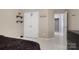 Bedroom showcasing closet, shelves, doorway, and carpet for comfortable living at 4764 Brockton Nw Ct, Concord, NC 28027