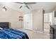 Neutral bedroom featuring tile floors, closet and built in shelving for convenient storage at 4764 Brockton Nw Ct, Concord, NC 28027