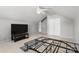 Bright bedroom with high ceilings, fan, and large window and furniture for comfortable living at 4764 Brockton Nw Ct, Concord, NC 28027