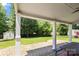 This home includes a covered patio that overlooks the lush backyard at 4764 Brockton Nw Ct, Concord, NC 28027