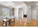 Spacious dining area with hardwood floors and an open layout, perfect for entertaining at 4764 Brockton Nw Ct, Concord, NC 28027
