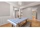Open dining room showcasing hardwood floors, modern chandelier, and access to the kitchen at 4764 Brockton Nw Ct, Concord, NC 28027
