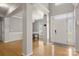 Inviting foyer with hardwood floors, modern lighting, and easy access to living spaces at 4764 Brockton Nw Ct, Concord, NC 28027