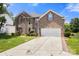 Charming brick home with a two-car garage, beautiful landscaping, and a long driveway that could accommodate extra parking at 4764 Brockton Nw Ct, Concord, NC 28027