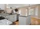 Modern kitchen with granite counters, a large island and stainless steel appliances at 4764 Brockton Nw Ct, Concord, NC 28027