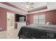 This home features a main bedroom with a large tv and a window at 4764 Brockton Nw Ct, Concord, NC 28027