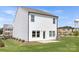 Expansive backyard with lawn, patio, and view of the home's white siding exterior at 492 Switch St # 82 Ty, York, SC 29745