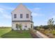New construction two-story home with white siding, well-maintained lawn, and sidewalk leading to the front door at 492 Switch St # 82 Ty, York, SC 29745